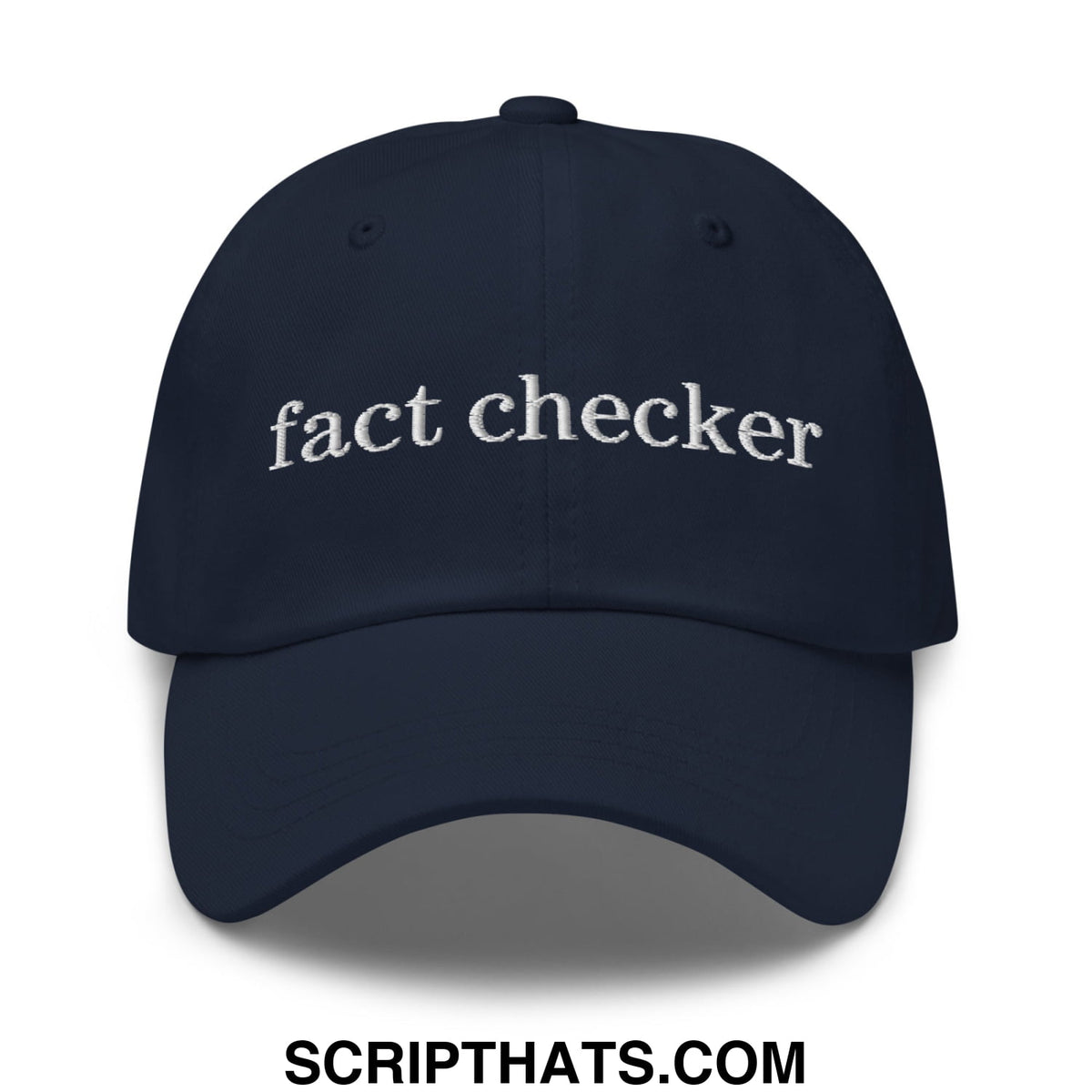 Navy blue unstructured dad hat with white embroidered fact checker text made from soft cotton fabric