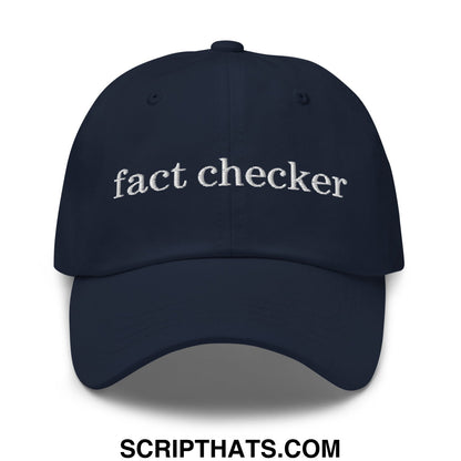 Navy blue unstructured dad hat with white embroidered fact checker text made from soft cotton fabric