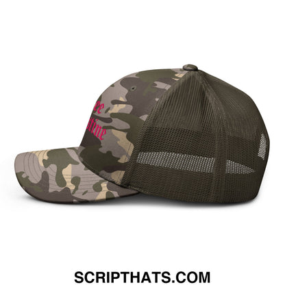 A camouflage-patterned mesh trucker hat with pink free palestine old english embroidered text on front
