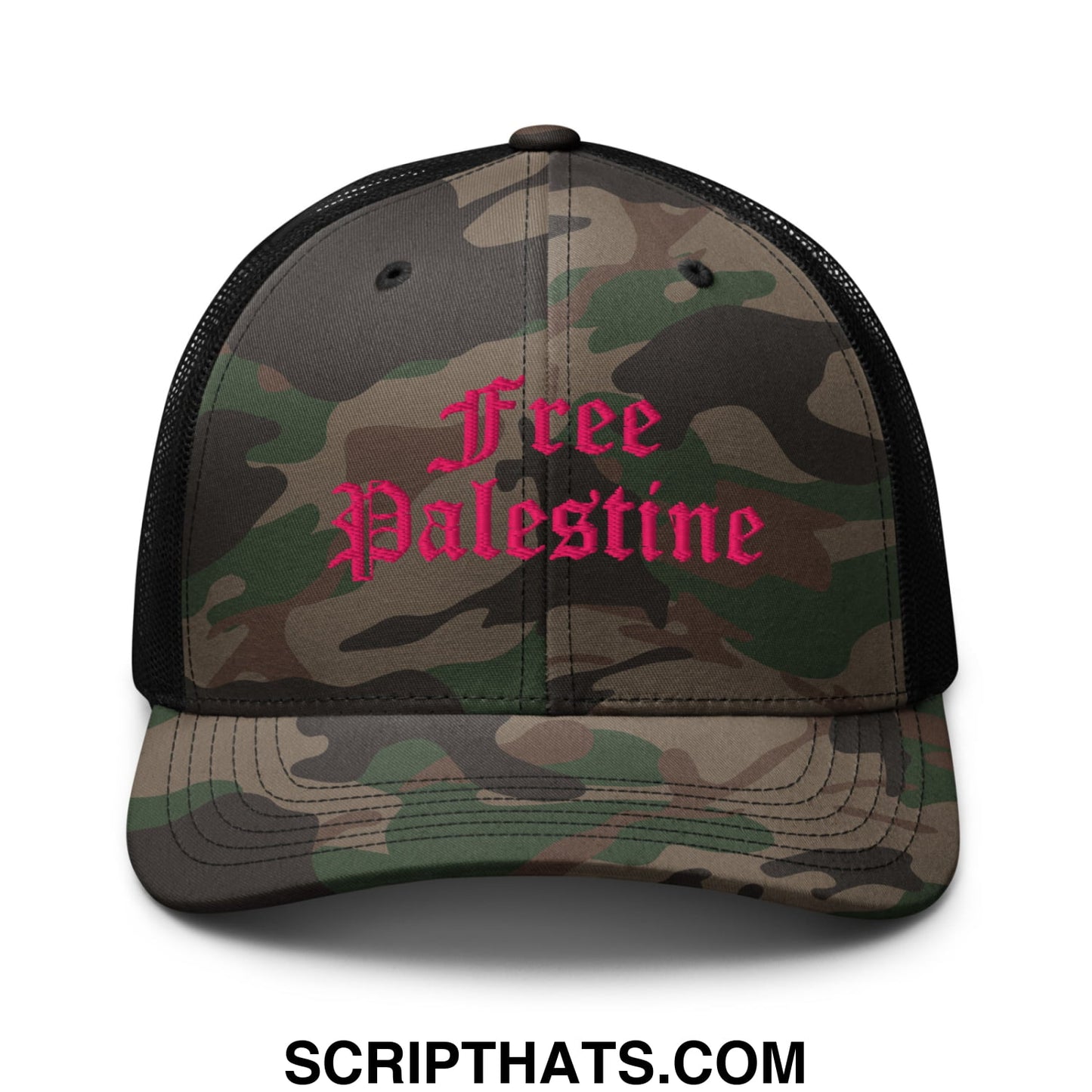 A camouflage mesh trucker hat with black sides and a pink embroidered free palestine logo in gothic script