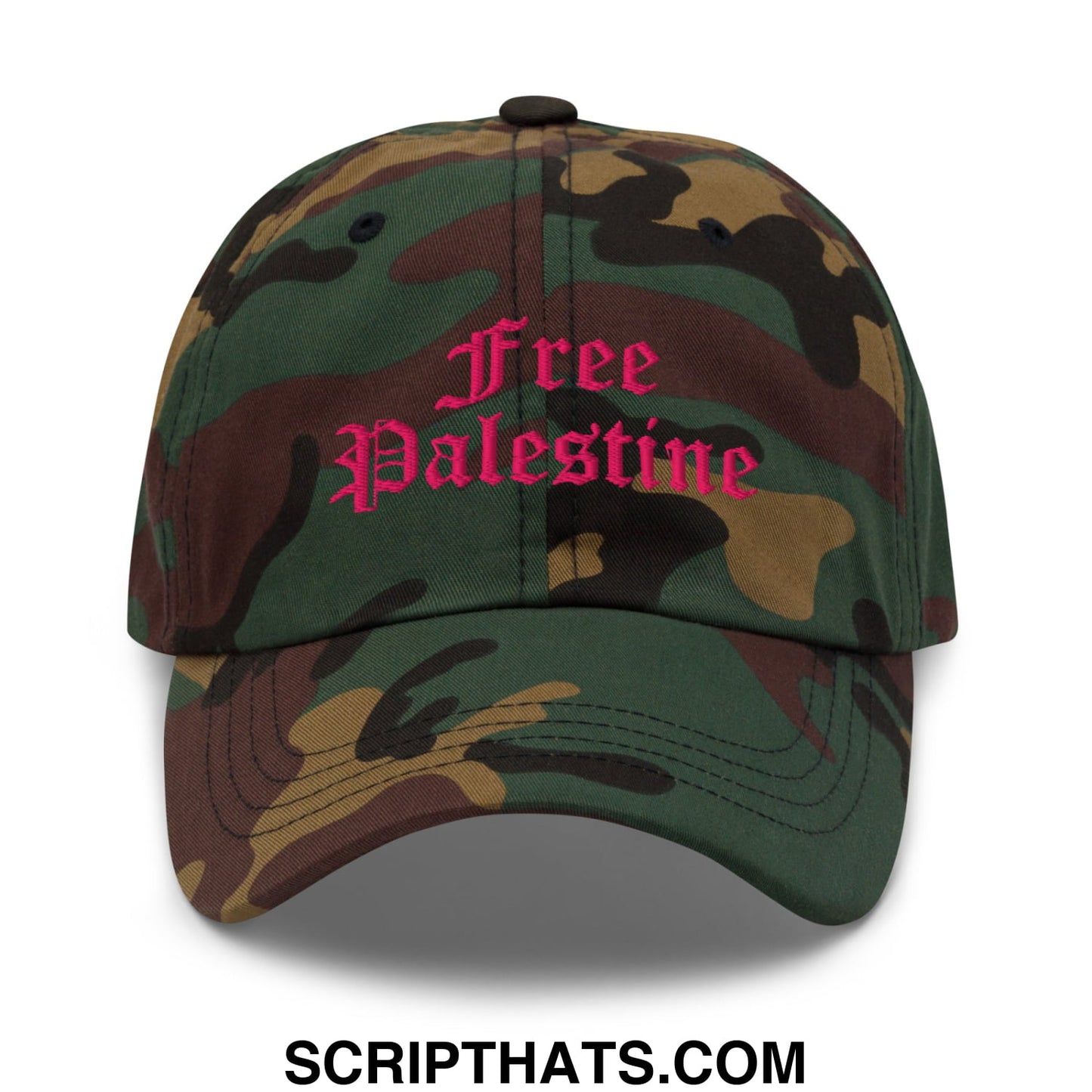 A camouflage unstructured dad hat with free palestine embroidered in pink script across the front