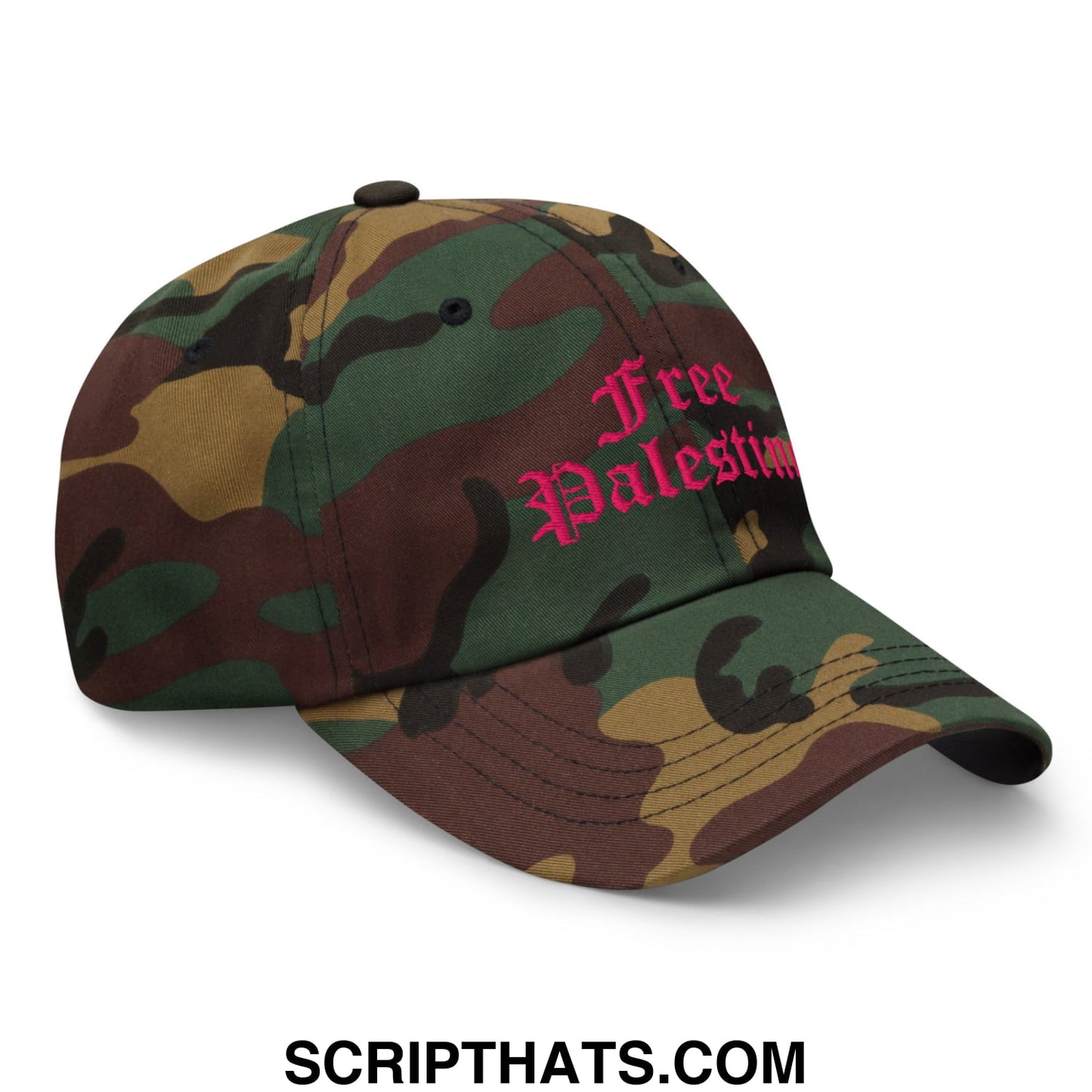 A camouflage baseball cap with free palestine embroidered in pink script in an unstructured dad hat style