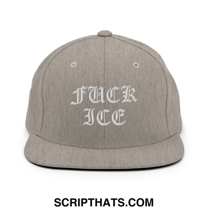 A gray snapback hat with white old English embroidered text fuck ice on a flat bill brim