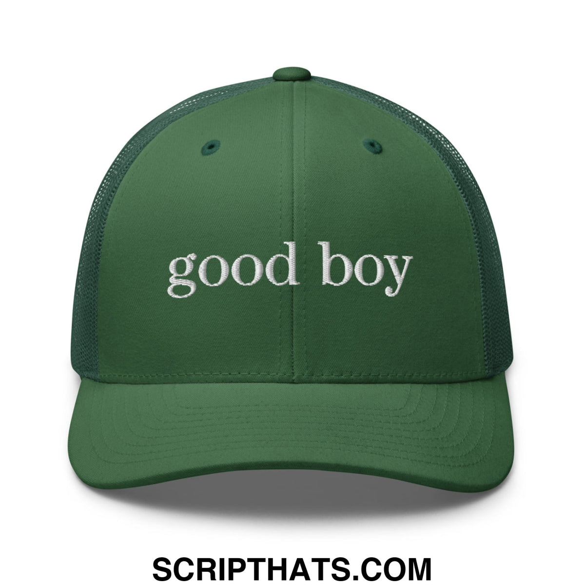 A dark green mesh trucker hat with white embroidered good boy text across the front