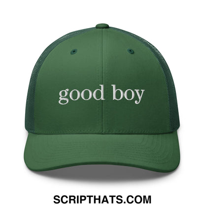 A dark green mesh trucker hat with white embroidered good boy text across the front