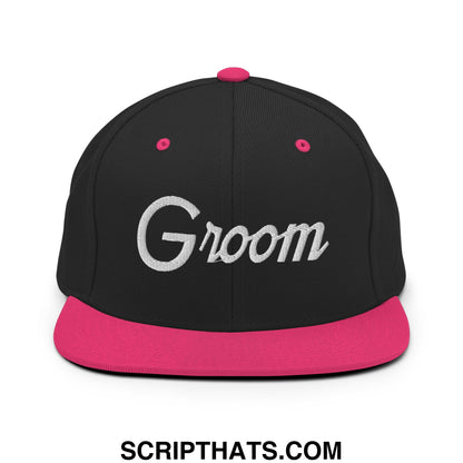 Black snapback cap with vibrant pink flat bill brim and button featuring silver groom embroidery in sports script style