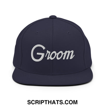 Navy blue snapback cap with white embroidered groom script on the front and flat bill brim for sports use