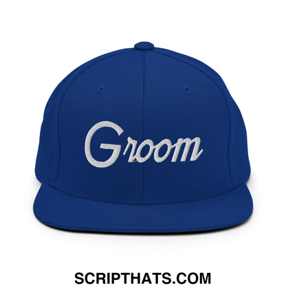 Royal blue snapback hat with white embroidered groom script and flat bill brim for sports or casual wear