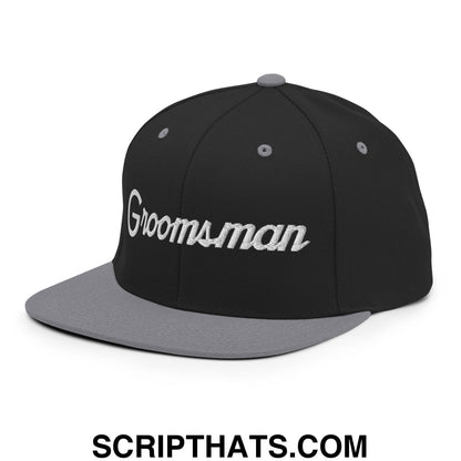 Black and gray snapback hat with groomsman embroidered in white script on flat bill brim for weddings