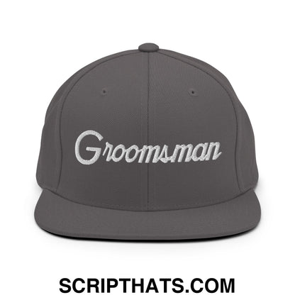 Gray snapback cap with white embroidered groomsman script on front flat bill brim for wedding party use