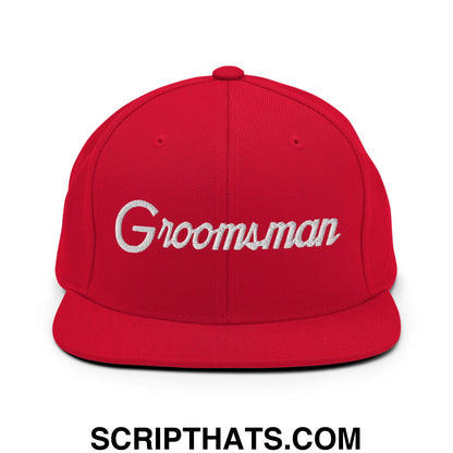 Red snapback hat with white embroidered groomsman script and flat bill brim perfect for wedding parties