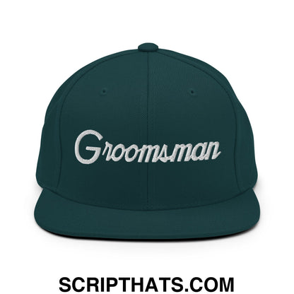 Dark green snapback hat with white embroidered groomsman script and flat bill brim for wedding party use