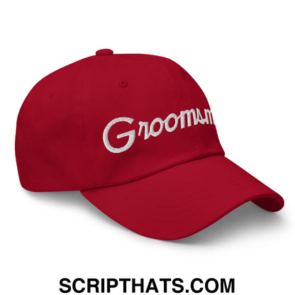 Red unstructured dad hat with white embroidered groomsmen text in sports script style