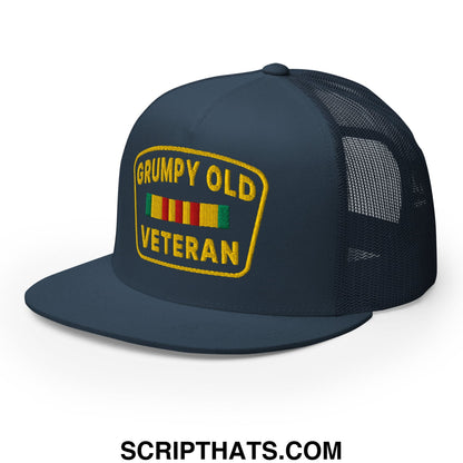 Dark navy blue mesh trucker hat with flat bill and yellow embroidered grumpy old veteran patch above colorful stripes