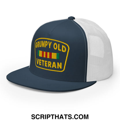 Navy blue and white mesh trucker hat with yellow embroidered grumpy old veteran patch featuring colorful ribbons