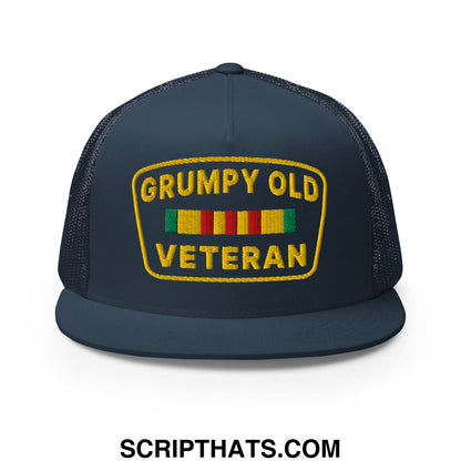 Dark blue mesh trucker hat with yellow embroidered grumpy old veteran patch and colorful ribbon design on front