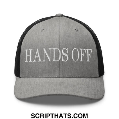 Gray and black mesh trucker hat with hands off embroidered in white on the front panel