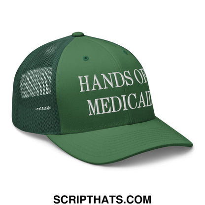 Dark green mesh trucker hat with white embroidered hands of medical text on front panels for hands off medicaid