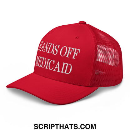 Red mesh trucker hat with white embroidered hands off Medicaid text on the front for advocacy wear