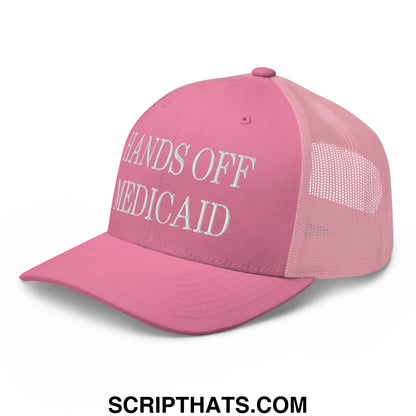 Pink mesh trucker hat with white embroidered hands off medicaid text on front panel for advocacy use