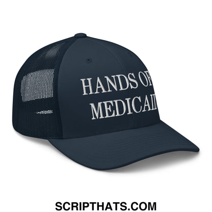 Dark navy mesh trucker hat with white embroidered hands of medicaid text on front for casual wear