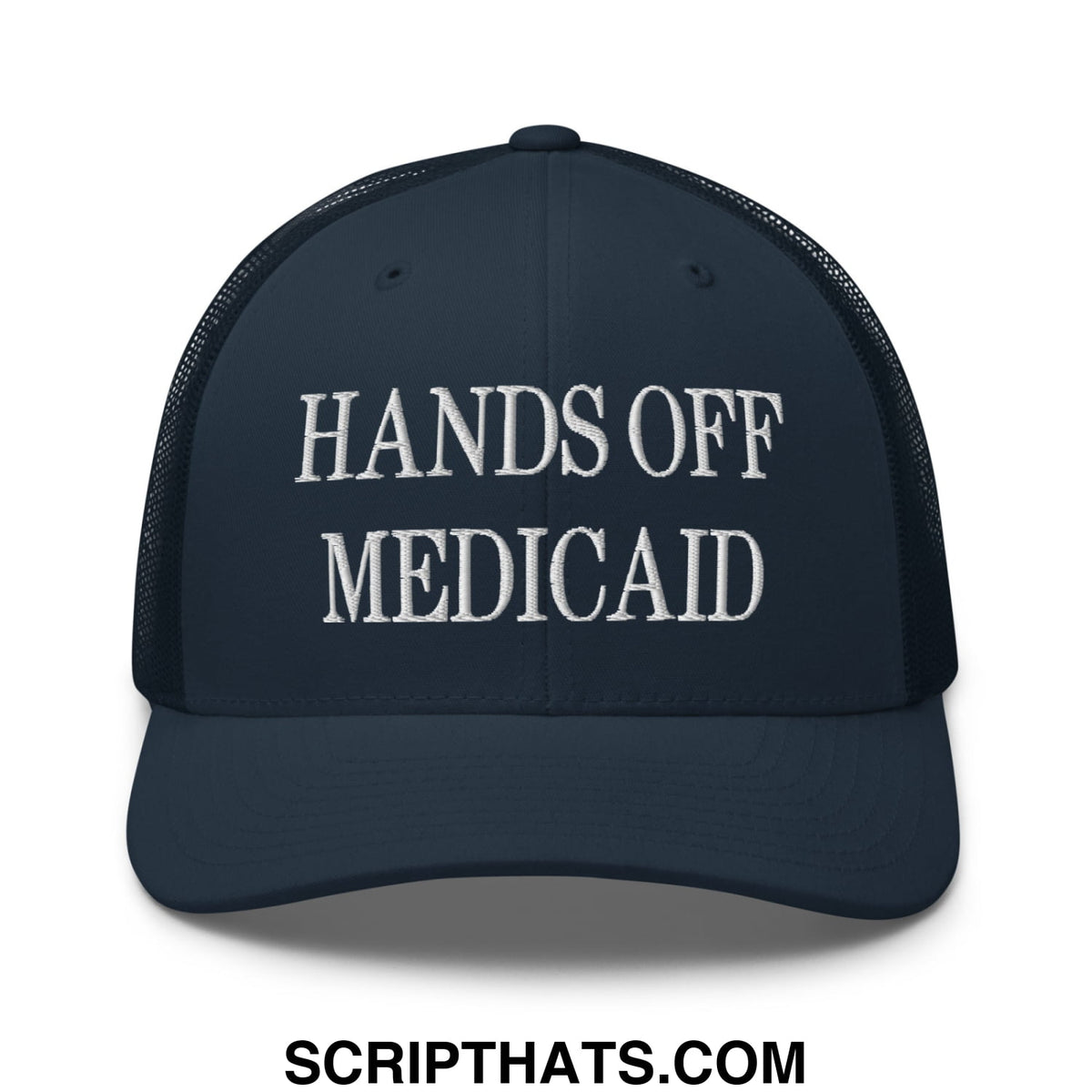 Dark navy mesh trucker hat with white embroidered hands off Medicaid text on the front panel