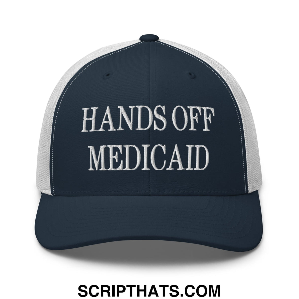 Navy blue and white mesh trucker hat with embroidered hands off medicaid text in bold capital letters