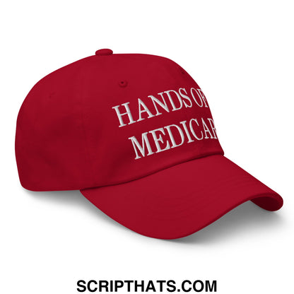 Red unstructured dad hat with white embroidered hands of medicare text for casual wear and sun protection