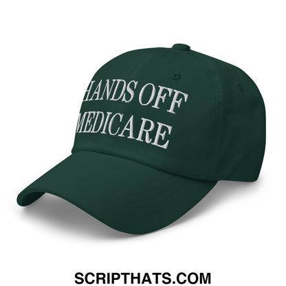 Dark green unstructured dad hat with white embroidered text hands off medicare promoting healthcare awareness
