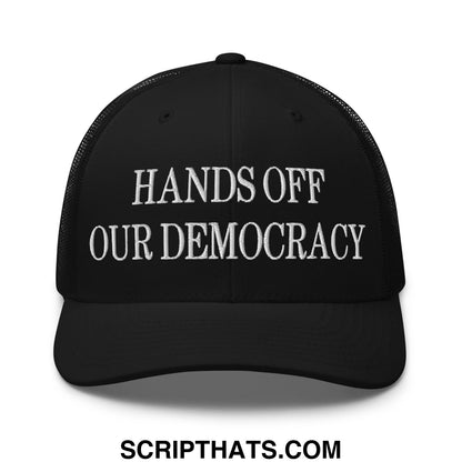 Black mesh trucker hat with white embroidered hands off our democracy text on the front panel