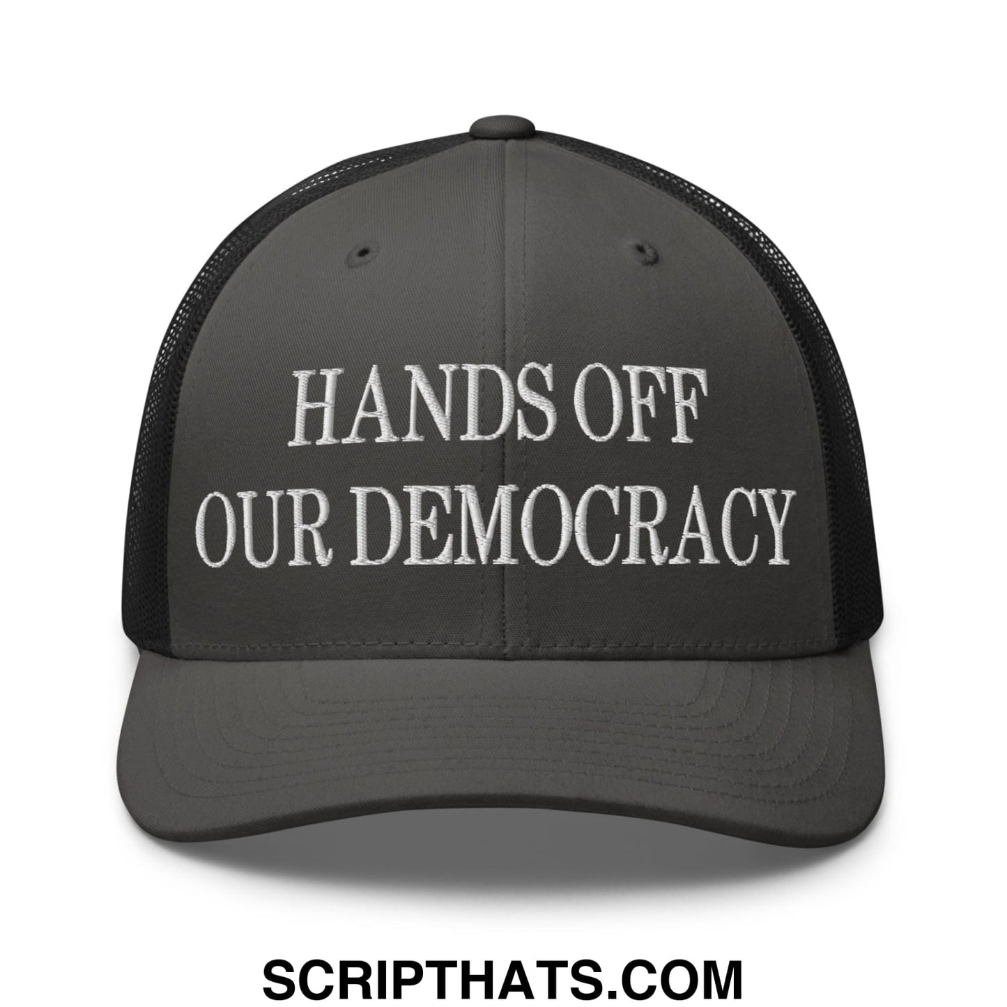 Dark gray mesh trucker hat with white embroidered hands off our democracy text on the front