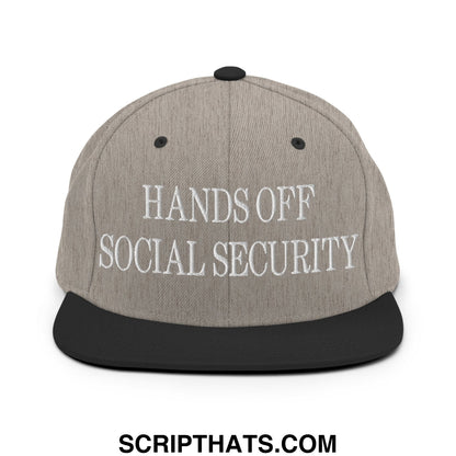 Gray snapback hat with black brim and embroidered white hands off social security text on front panel