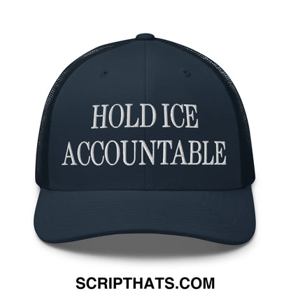 Dark navy mesh trucker hat with white embroidered text hold ice accountable across the front
