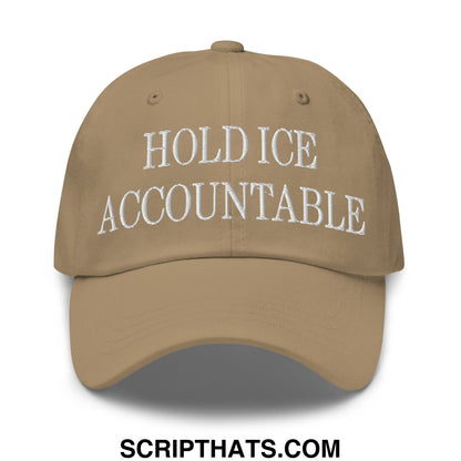 Tan unstructured dad hat with white embroidered text reading hold ice accountable on the front