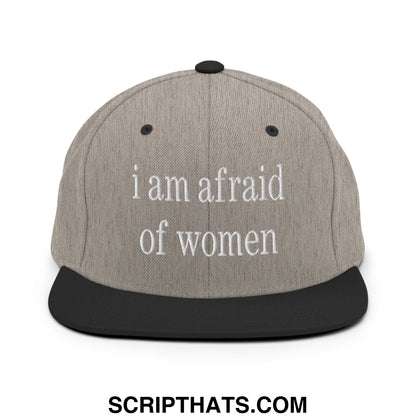 Gray snapback hat with black brim and button featuring white embroidered i am afraid of women text on front