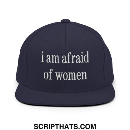 Navy blue snapback hat with white embroidered i am afraid of women text and a flat bill brim design