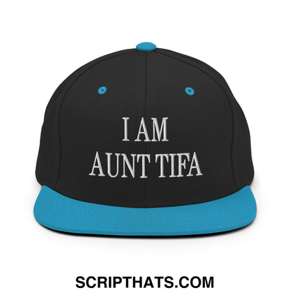 Black snapback cap with teal brim and button featuring white embroidered text i am aunt tifa flat bill brim hat