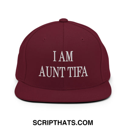 Maroon snapback cap with white embroidered i am aunt tifa text and flat bill brim for casual wear