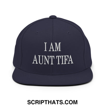 Navy blue snapback hat with white embroidered i am aunt tifa text and flat bill brim design