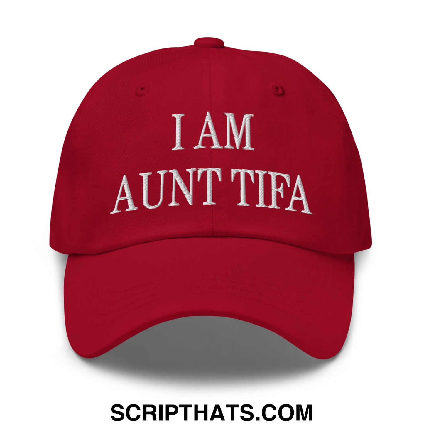 A vibrant red embroidered unstructured dad hat with i am aunt tifa lettering on the front