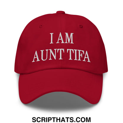 A vibrant red embroidered unstructured dad hat with i am aunt tifa lettering on the front