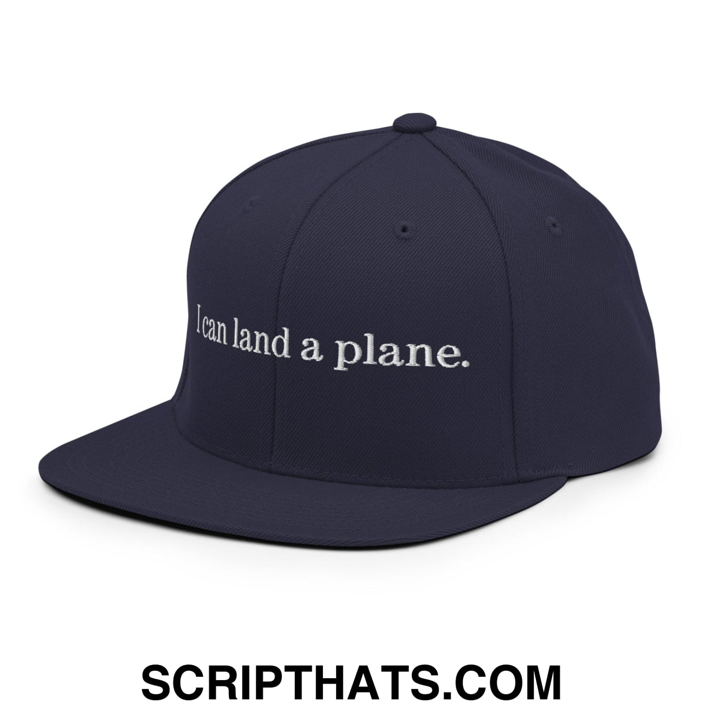 Navy blue snapback hat with white embroidered i can land a plane text on flat bill brim in cotton material