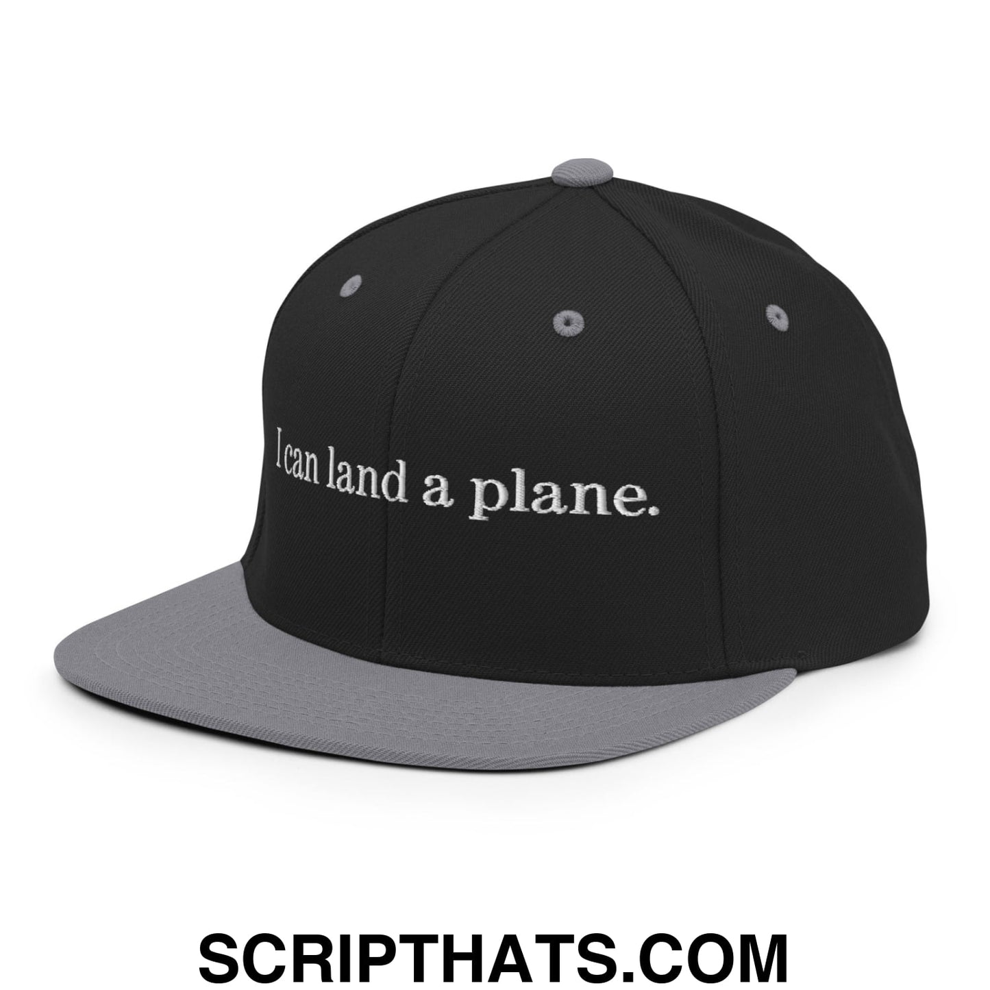 Black and gray snapback cap with white embroidered text i can land a plane flat bill brim hat