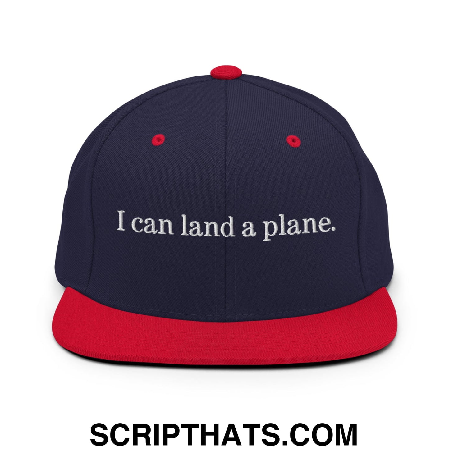 Navy blue snapback hat with red brim and button featuring white embroidered text i can land a plane
