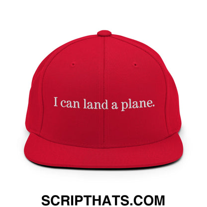 Red snapback cap with white embroidered i can land a plane text and flat bill brim for casual wear