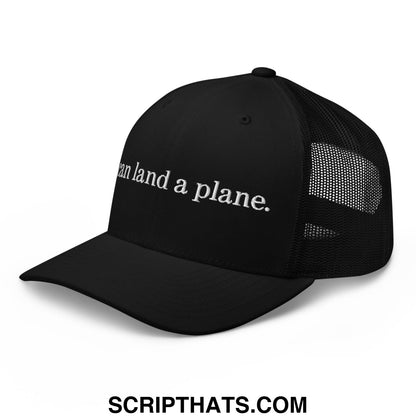 Black mesh trucker hat with white embroidered text can land a plane featuring breathable material and adjustable fit