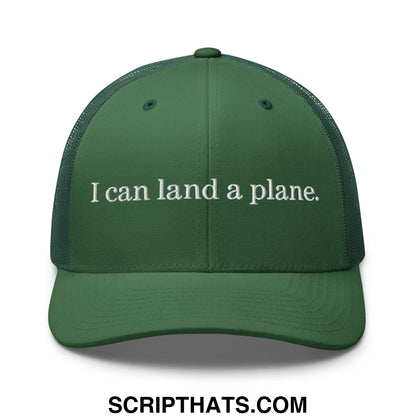 Dark green mesh trucker hat with white embroidered text i can land a plane in bold font