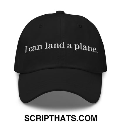 Black unstructured dad hat with white embroidered i can land a plane text on the front panel