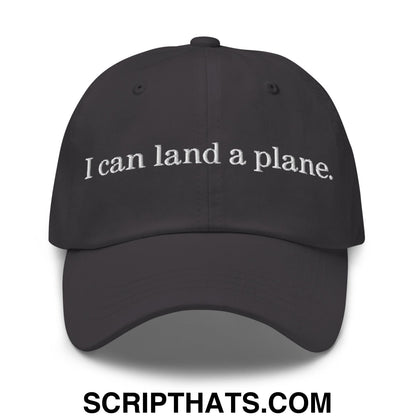 Black unstructured dad hat with white embroidered text i can land a plane for casual wear