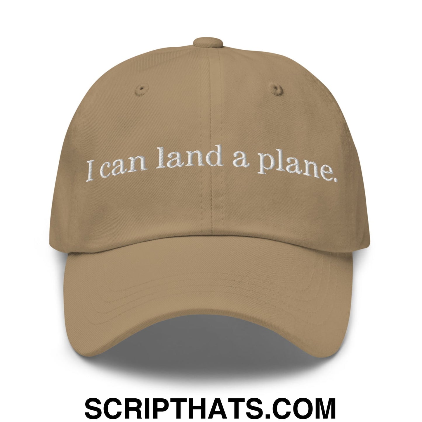 Tan unstructured dad hat with white embroidered text i can land a plane featuring a casual baseball cap design